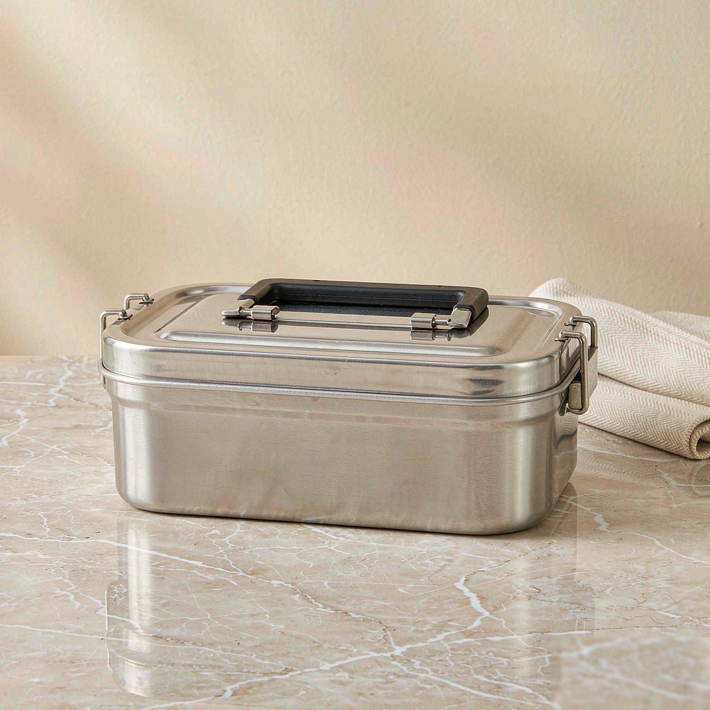 Insulated stainless steel bento lunch box with a folding carry handle and locking clips
