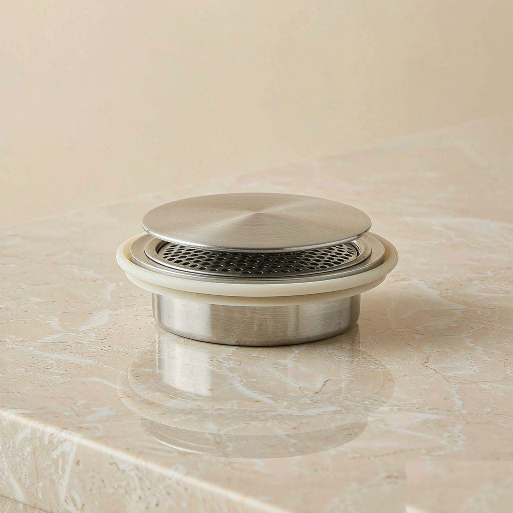 Universal stainless steel sink stopper drain plug with a silicone seal