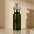 Dark green glass 2-in-1 olive oil dispenser with a spray nozzle and pour spout