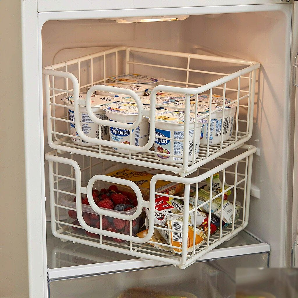 Stackable wire bins organizing a shelf inside a refrigerator